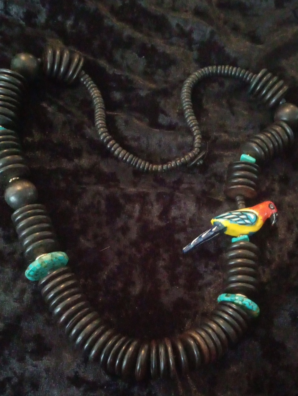 Vintage Black Beaded Necklace with Turquoise Accents and Colorful Parrot Charm